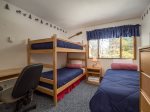 bedroom two has a twin and set of bunks twins